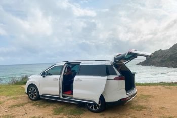 Luxco Travels - Kia Carnival 7-Seater by the Beach from Hanoi to Halong Bay