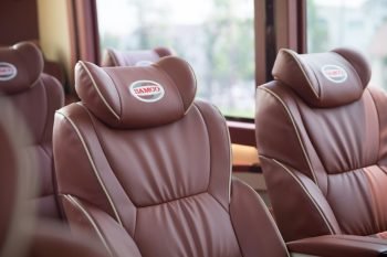 Luxurious leather seats inside a 16-seater Felix Limousine van used for travel between Halong Bay and Ninh Binh