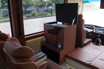 Driver's cabin and front passenger area of a luxurious 16-seater Felix Limousine van with comfortable leather seats and modern amenities