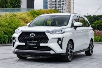 White Toyota Veloz Cross parked outdoors, used for private transfer service between Hanoi and Halong Bay