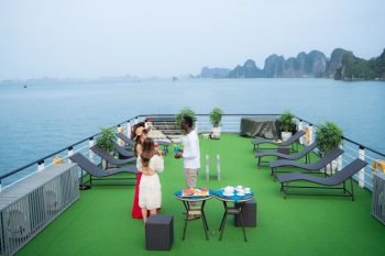 Guests enjoying drinks on the deck of La Casta cruise ship in Ha Long Bay