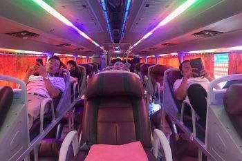 Sleeping bus interior with leather seats and modern amenities on the Dragon Sleeping bus from Hanoi to Sapa
