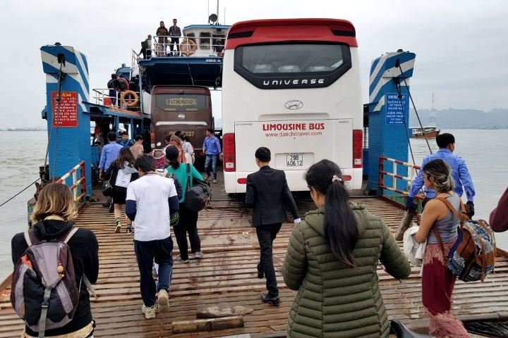 Passengers boarding Cat Ba Express Bus from Hanoi to Cat Ba at Ferry Terminal